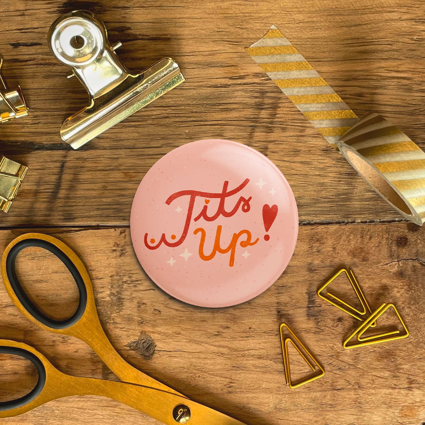 Button »Tits Up«